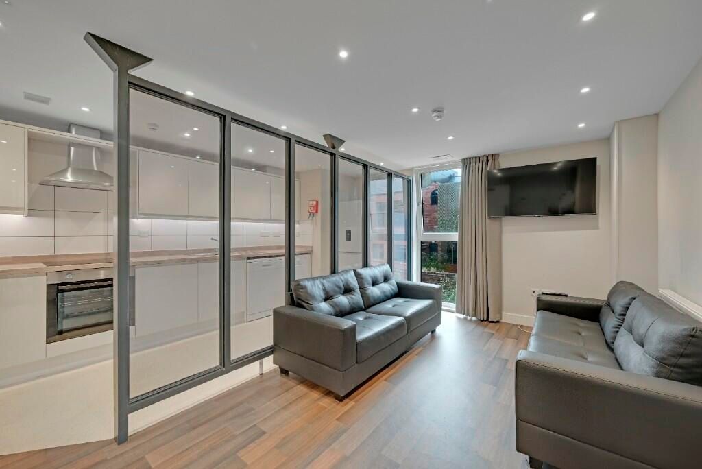 Property photo 3 of 16 A Modern Living Room With Comfortable Black Leathe...