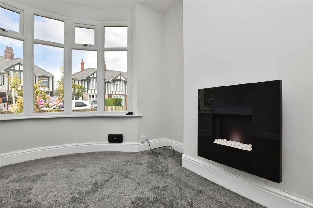 Property photo 2 of 16 Lounge Feature & Fireplace