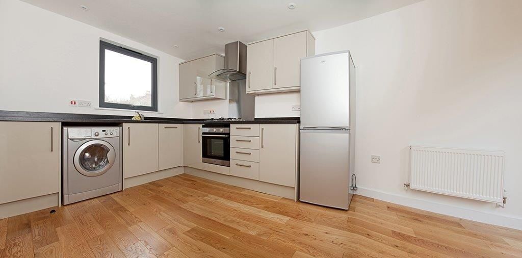 Property photo 2 of 6 Modern Kitchen With Sleek Appliances And Storage...