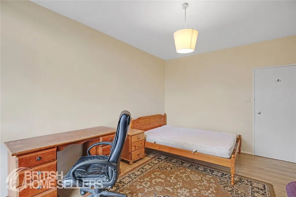 Property photo 3 of 8 Simple Single Bedroom Featuring A Wooden Bed Frame...