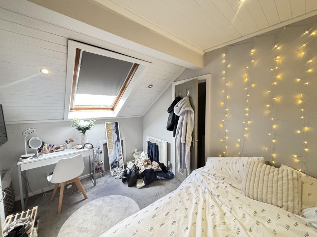 Property photo 1 of 24 A Spacious And Inviting Master Bedroom With A Cozy...