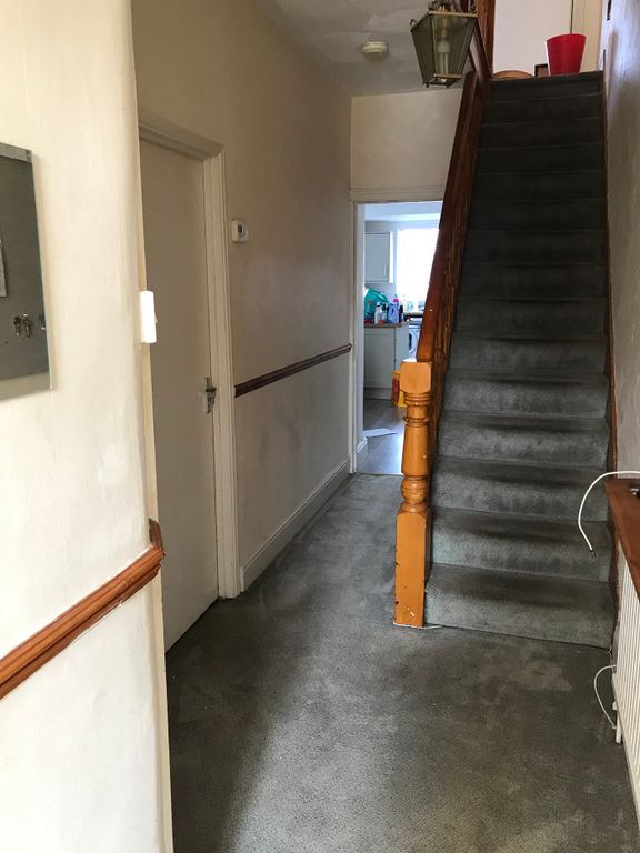 Property photo 2 of 12 Welcoming Hallway With Ample Space, Leading To A W...