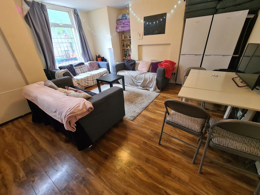 Property photo 1 of 14 Bright And Welcoming Living Room Featuring Comfort...