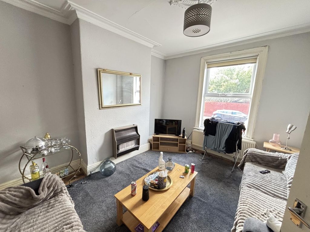 Property photo 1 of 15 A Bright And Inviting Living Room With Large Windo...