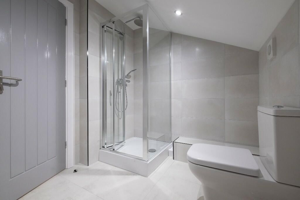 Property photo 2 of 15 Modern Bathroom Suite Featuring A Sleek Glass Show...