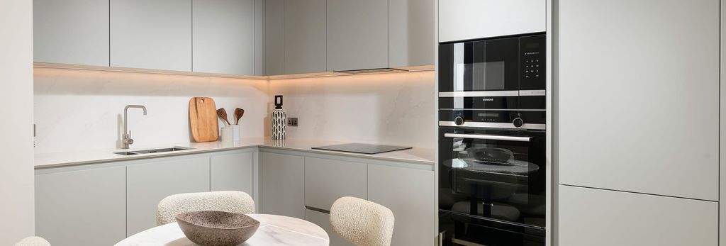 Property photo 2 of 4 Kitchenette With Off-White Grey Cabinets, Tops And Appliances, Round Dining Table