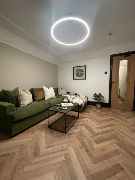 Property photo 3 of 4 Modern And Stylish Living Room Featuring A Comfort...