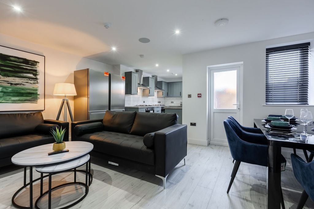 Property photo 1 of 7 Modern And Stylish Living Room With Sleek Black So...