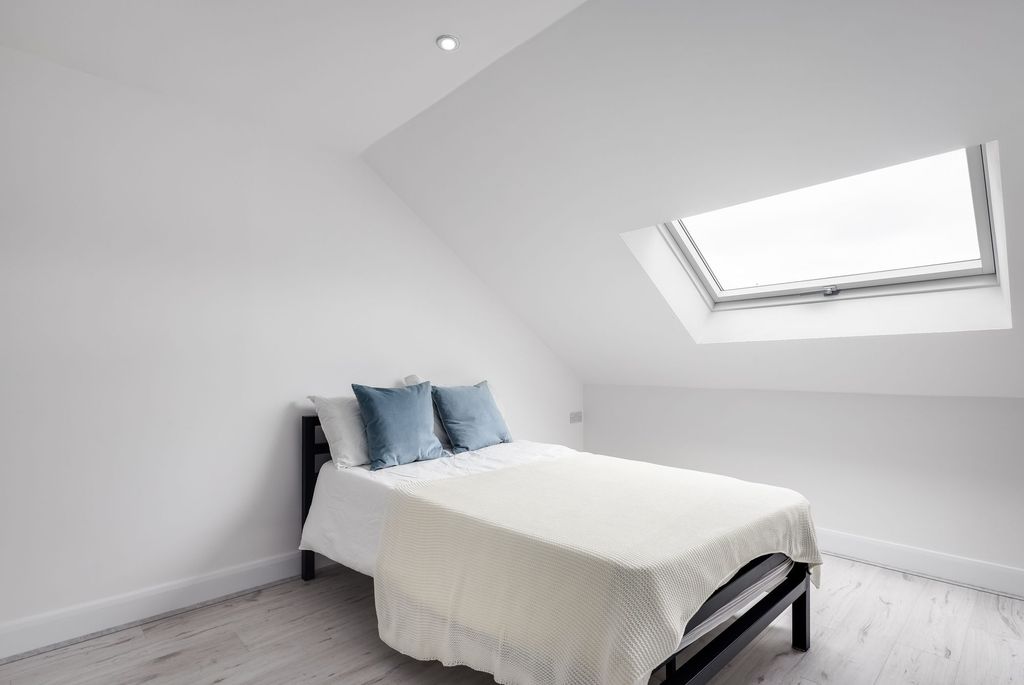 Property photo 2 of 3 Bright And Airy Bedroom Featuring A Comfortable Do...