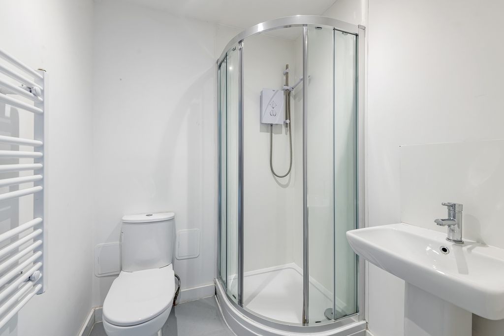 Property photo 3 of 3 A Modern And Clean Bathroom Featuring A Stylish Sh...