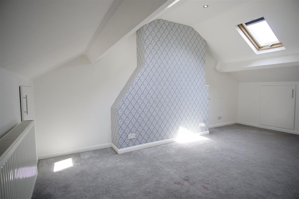 Property photo 2 of 11 Attic Bedroom