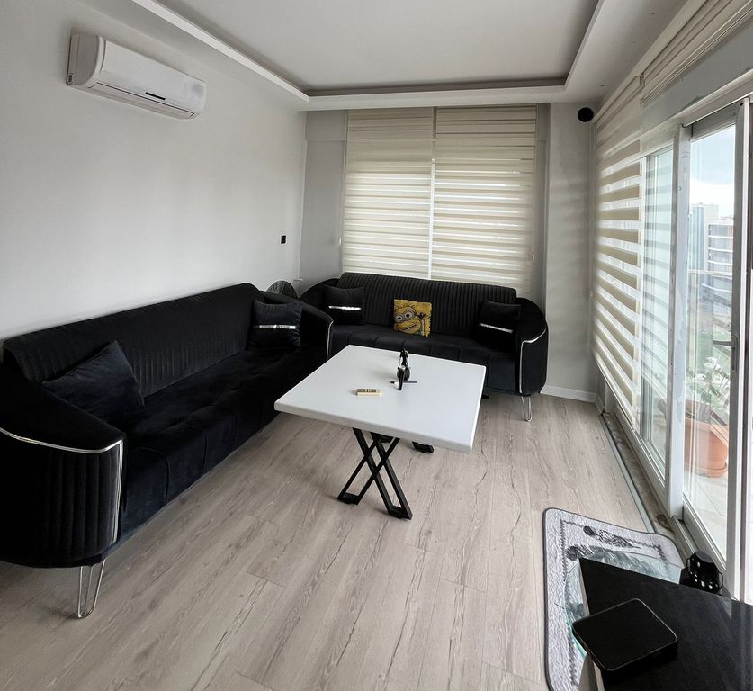 Property photo 3 of 10 Modern One-Bedroom Apartment For Sale In Antalya - Lounge With Exterior Access