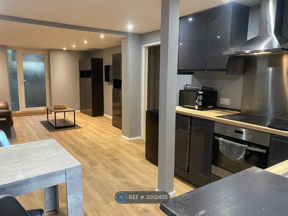 Property photo 1 of 11 Kitchen + Dining + Living