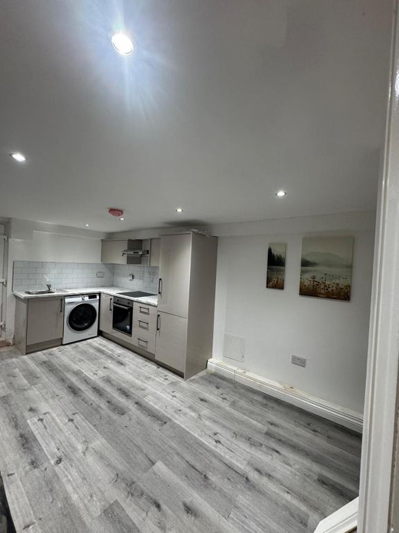 Property photo 1 of 8 Modern Kitchen With Sleek Cabinetry, Integrated Ov...