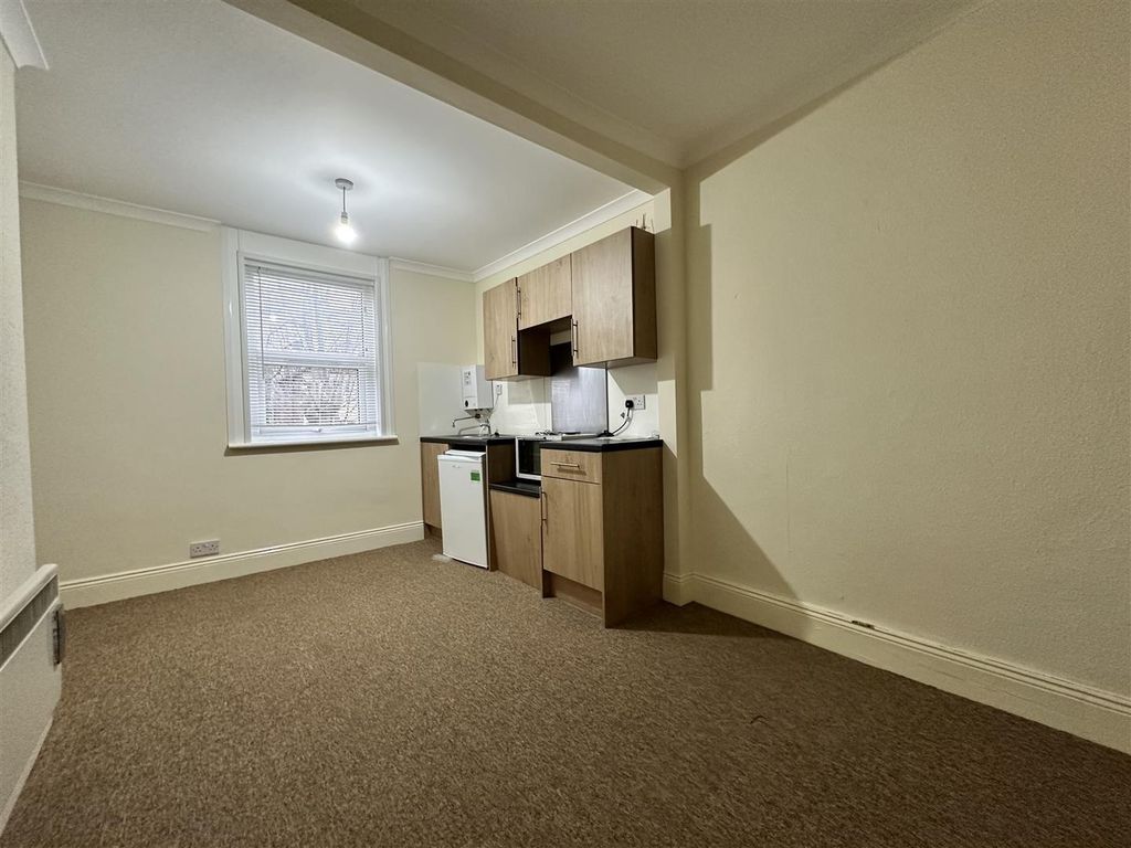 Property photo 1 of 5 Bright And Tidy Kitchen With Wooden Cabinetry...