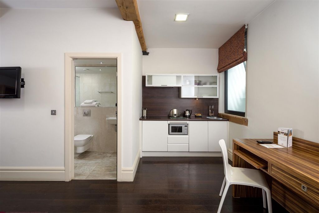 Property photo 2 of 5 Modern Kitchenette With Dining Desk And Sleek Fit...