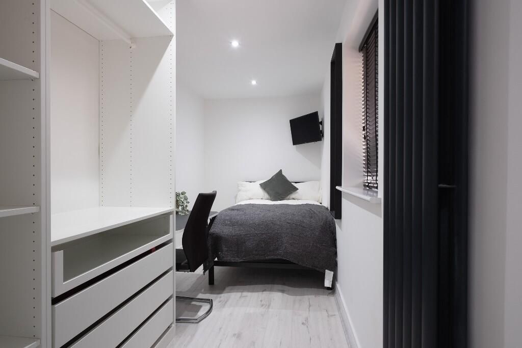Property photo 1 of 13 A Modern, Well-Lit Bedroom Featuring A Double Bed,...
