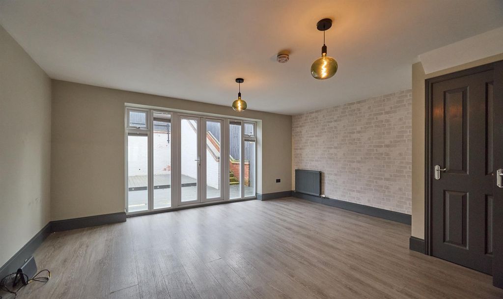 Property photo 3 of 13 Lounge/Dining Area