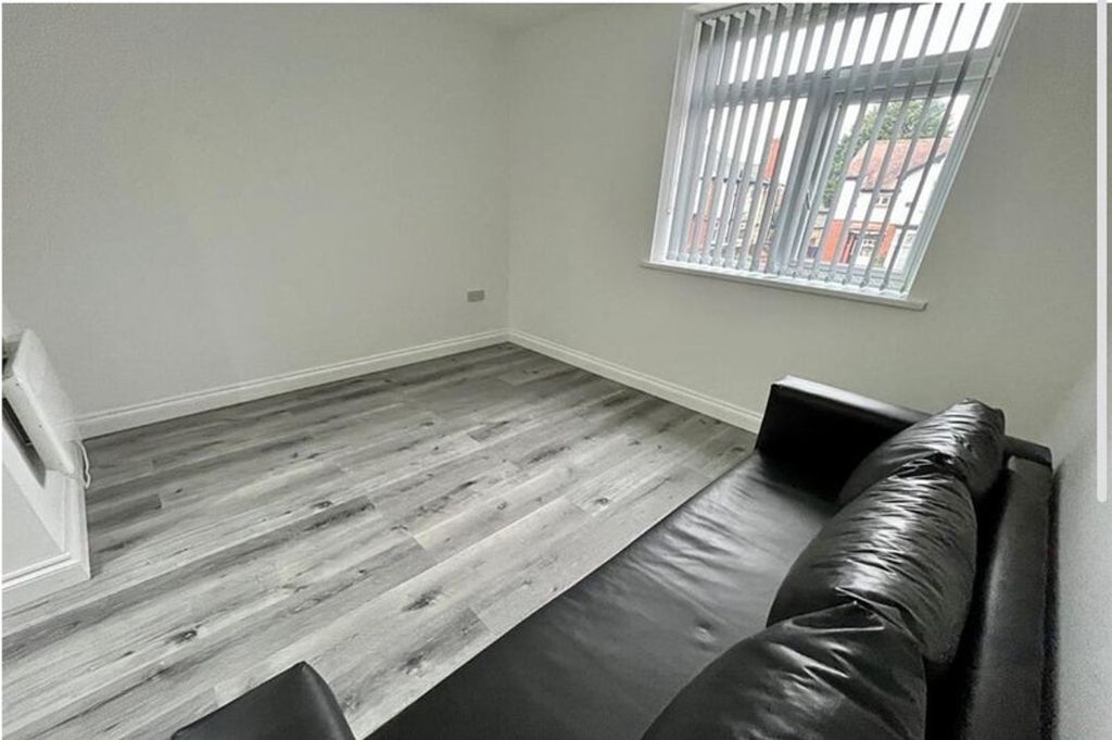 Property photo 3 of 6 Bright And Inviting Living Room Featuring Modern d...