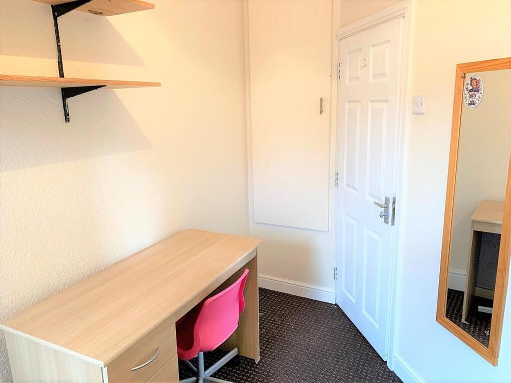 Property photo 2 of 12 Bright And Tidy Workspace Featuring A Functional d...