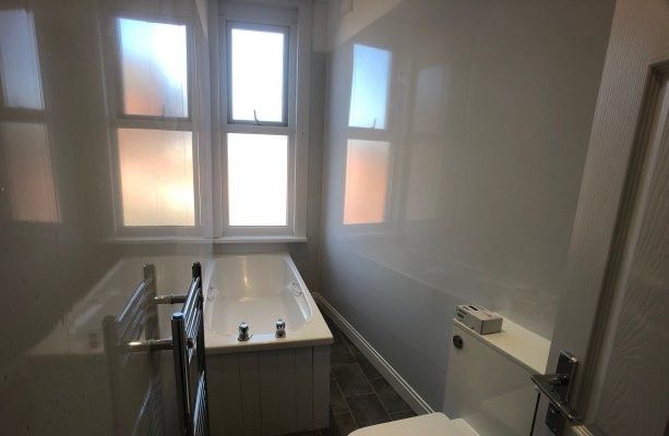Property photo 3 of 12 Bright And Clean Bathroom With Multiple Windows Pr...