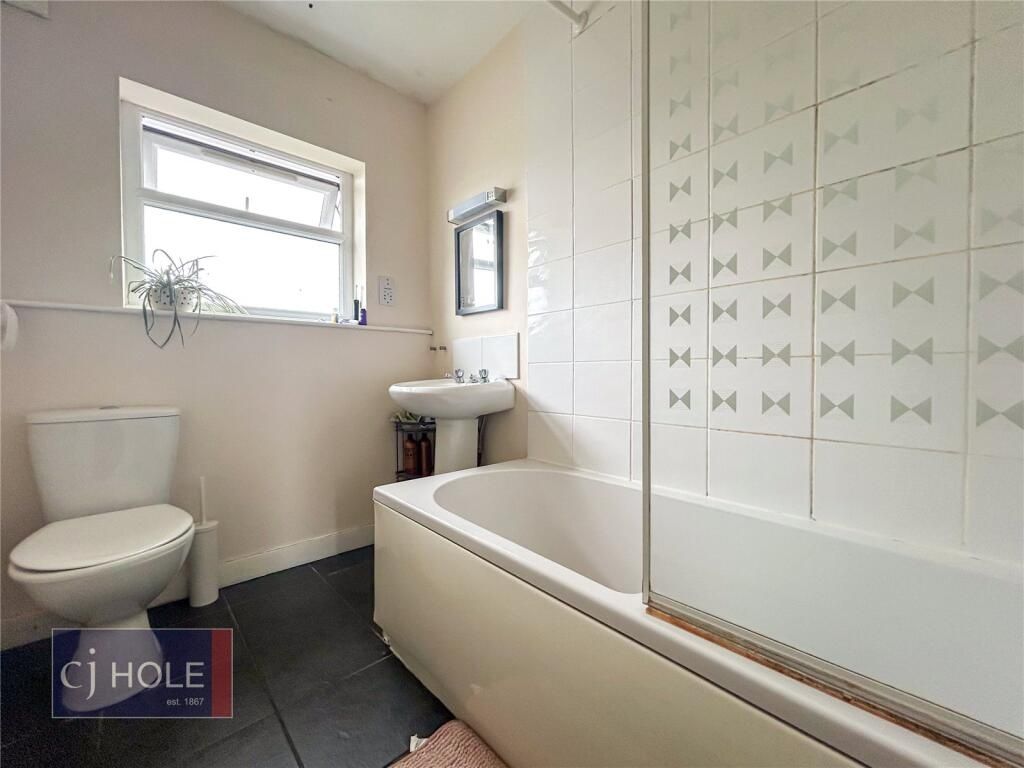 Property photo 3 of 15 Bright And Clean Bathroom Featuring A Full Bathtub...