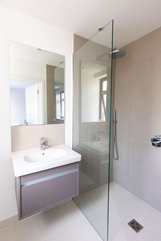 Property photo 1 of 9 A Modern And Stylish Bathroom Featuring A Sleek Sh...