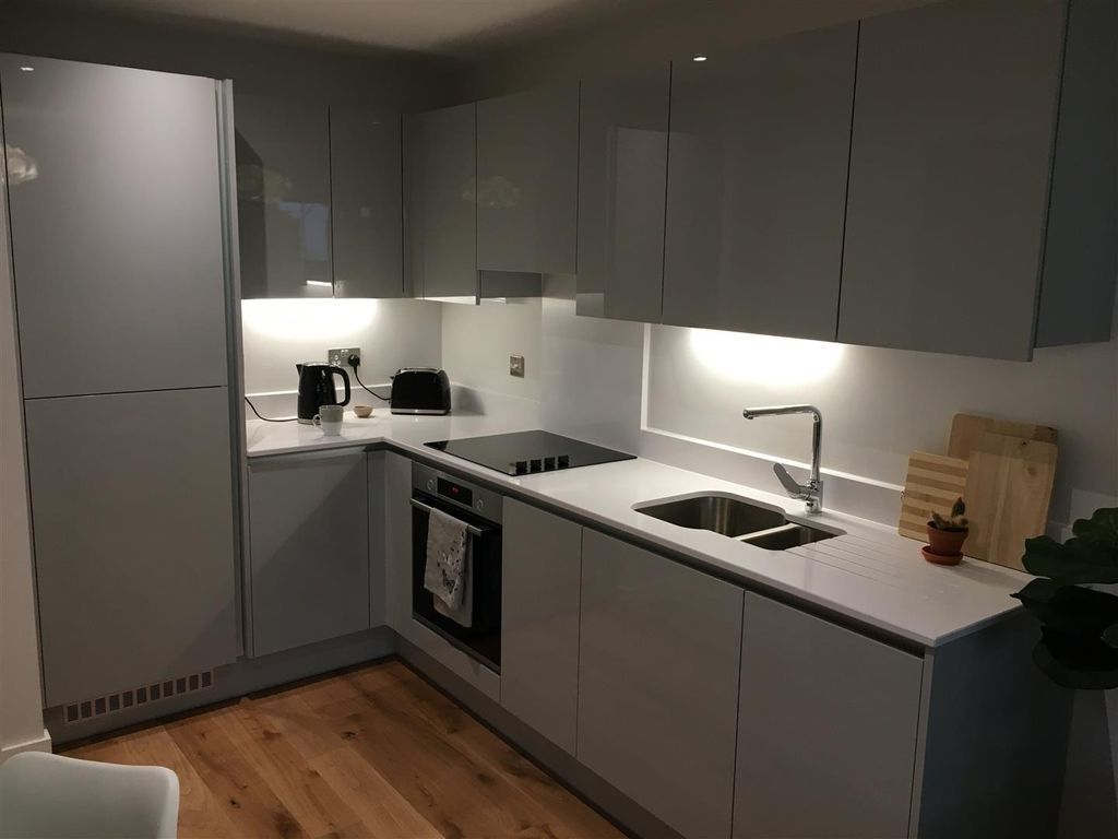 Property photo 3 of 9 Sleek Modern Kitchen With High-Gloss Cabinets...