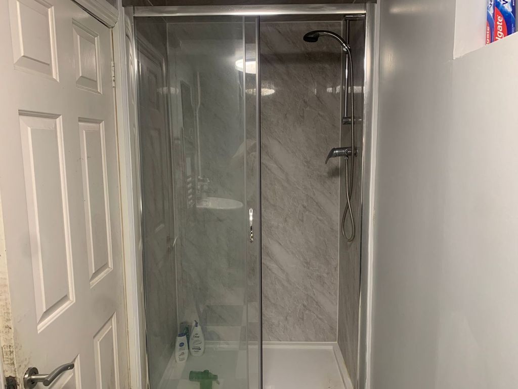 Property photo 3 of 11 Modern Walk-In Shower With Sleek Marble Tiling....