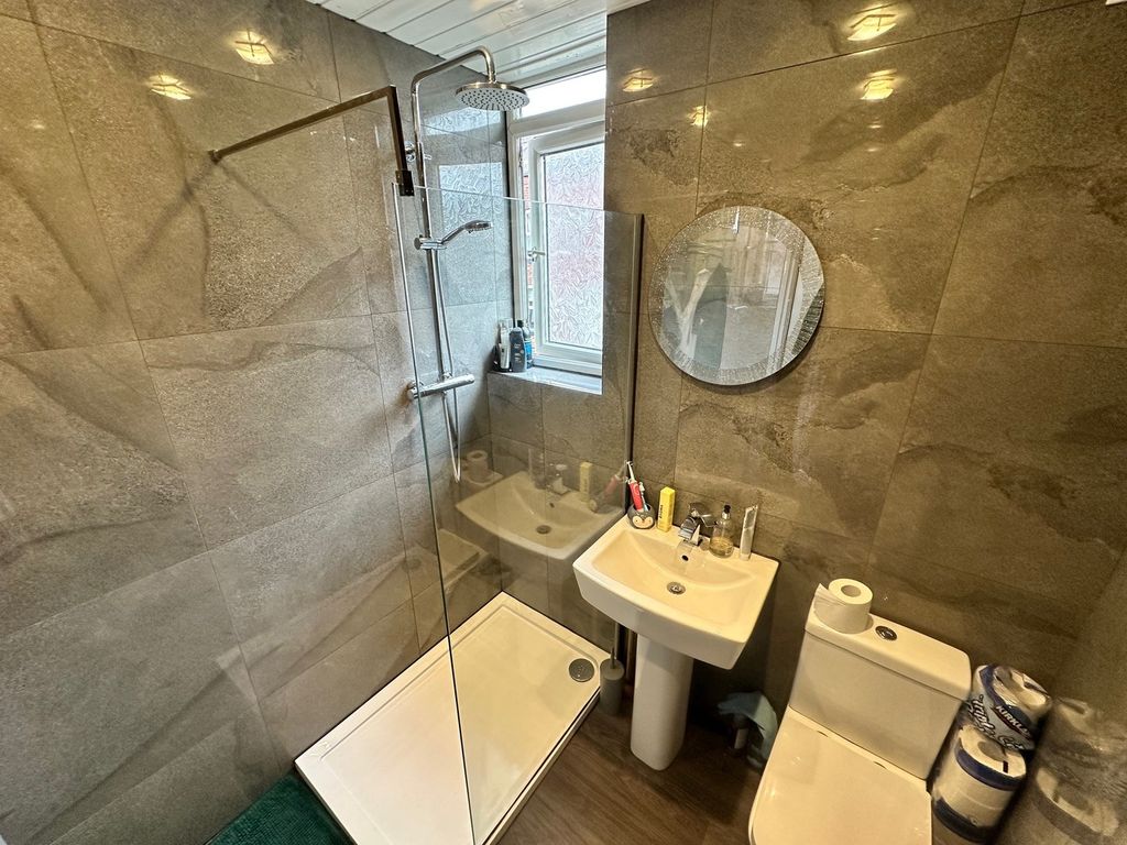 Property photo 2 of 5 This Modern Bathroom Features A Spacious Shower Wi...