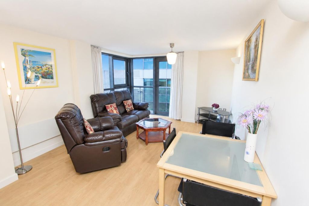 Property photo 1 of 9 Bright Lounge With Plush Sofas And Large Windows...