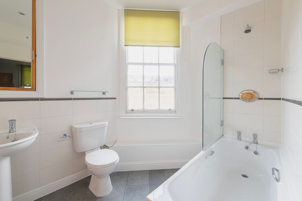 Property photo 2 of 5 A Bright And Clean Bathroom Featuring A Bathtub An...