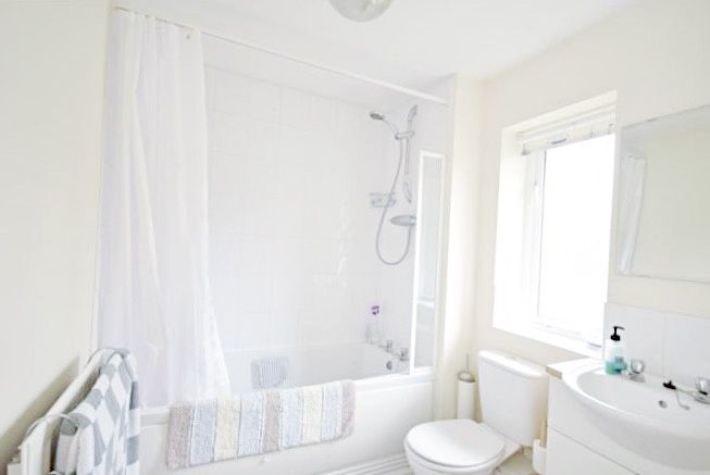 Property photo 2 of 11 Bright, Clean Bathroom With A Bathtub And Overhead...