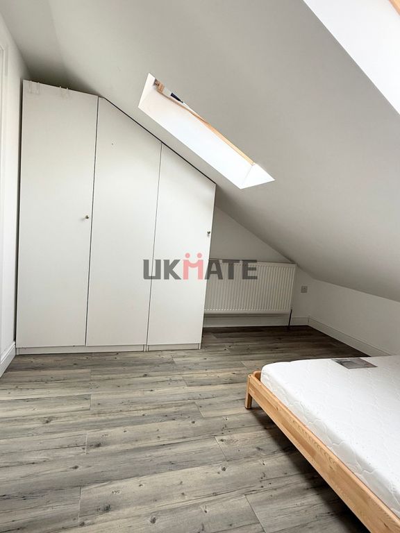 Property photo 2 of 7 A Bright And Tidy Bedroom Featuring A White Wardro...