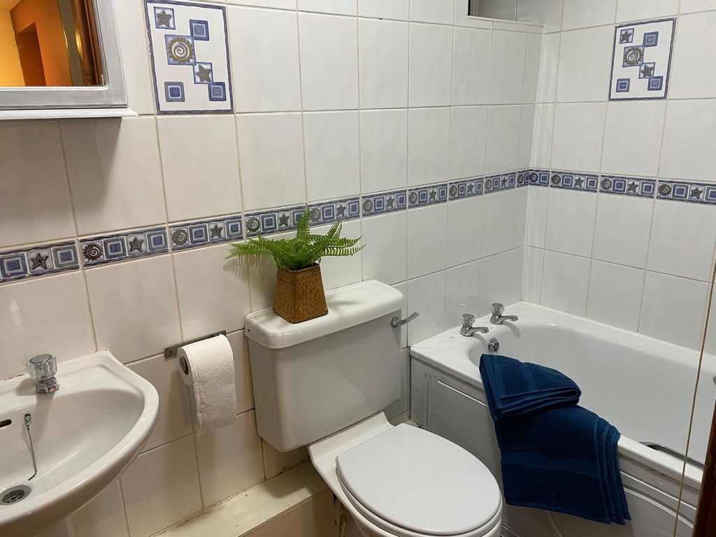 Property photo 1 of 5 Enjoy A Well-Maintained Bathroom Featuring A Relax...