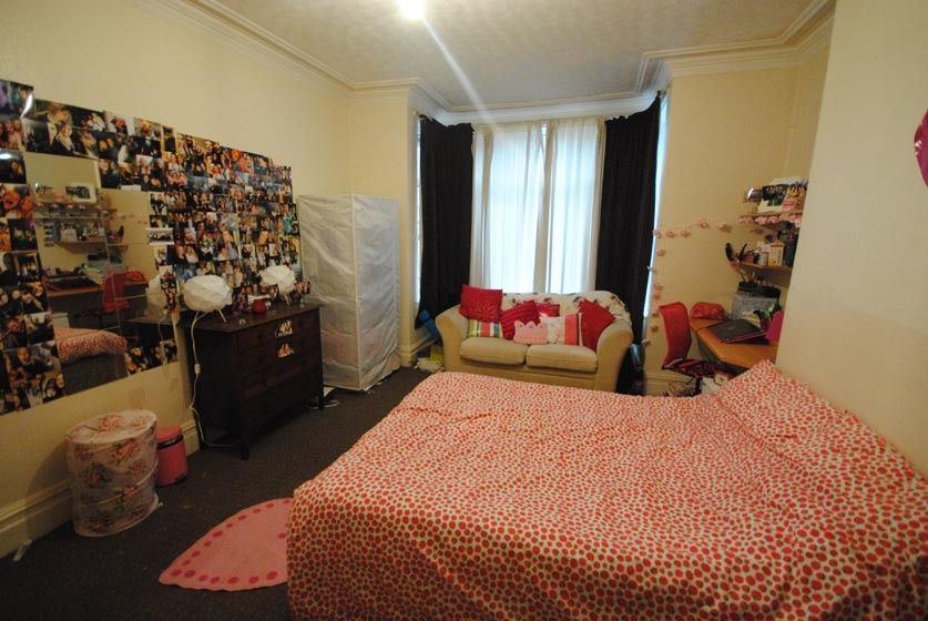 Property photo 2 of 9 A Cozy Bedroom Featuring A Double Bed And Vibrant ...
