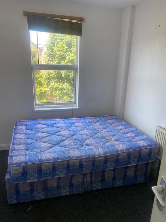 Property photo 3 of 5 Bright Bedroom With A Large Window Overlooking Tre...