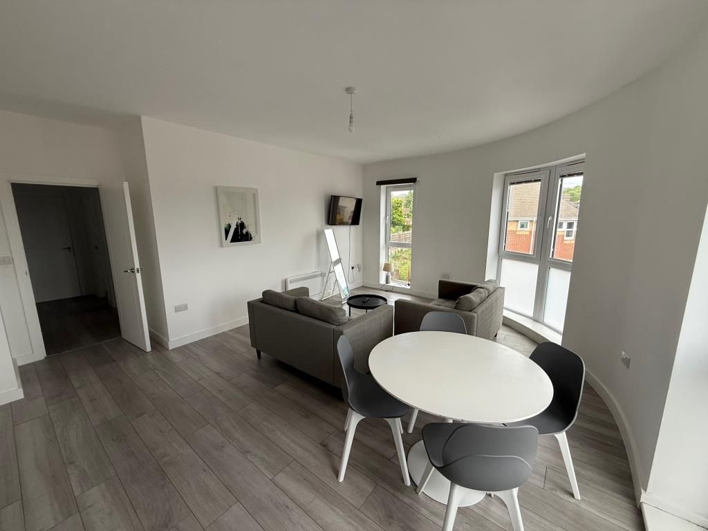 Property photo 3 of 6 Living Room With White Painted Walls And Grey Flooring