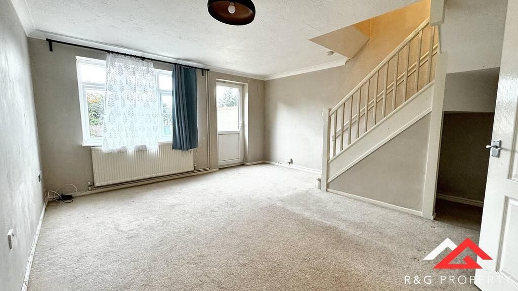 Property photo 1 of 10 Bright, Neutral-Toned Living Room With Large Front...
