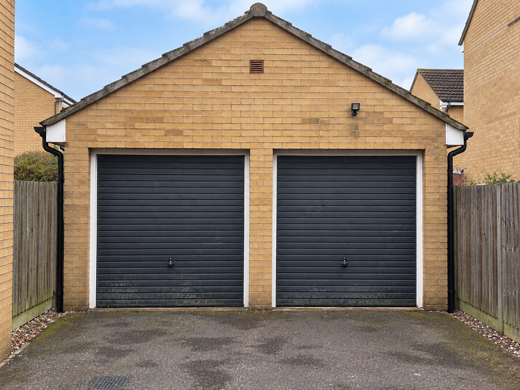 Property photo 2 of 13 Garage & Driveway