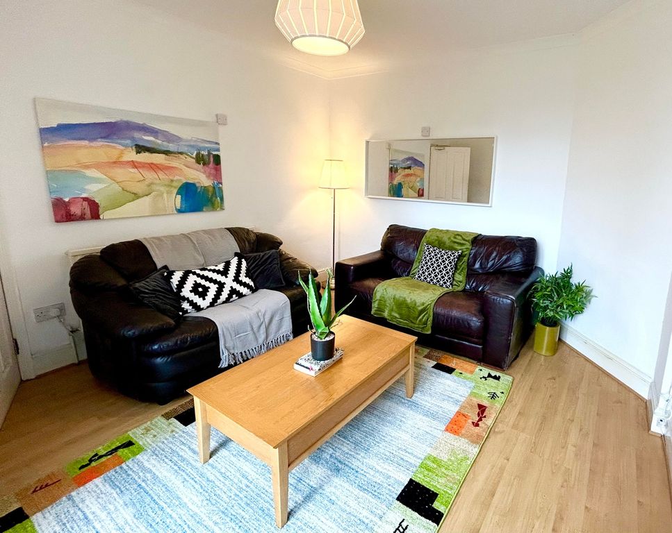 Property photo 2 of 9 A Cozy And Inviting Living Room Featuring Comforta...