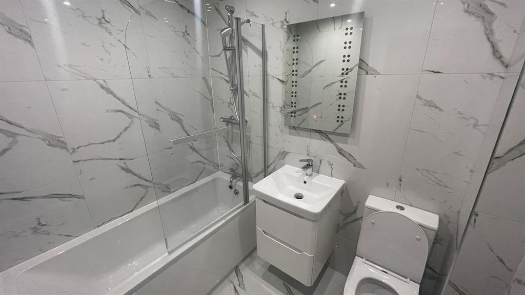 Property photo 3 of 7 Contemporary Bathroom With Marble-Effect Wall Tile...