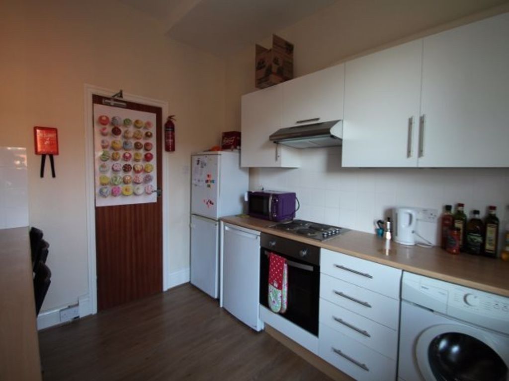 Property photo 3 of 8 A Modern And Well-Maintained Kitchen Featuring Whi...