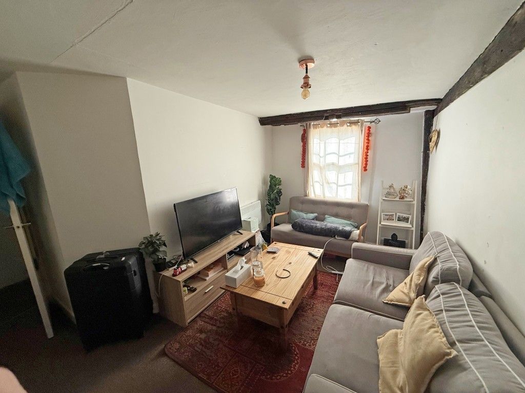 Property photo 2 of 6 Upstairs Carpeted Flat Lounge With Window And Exposed Beams