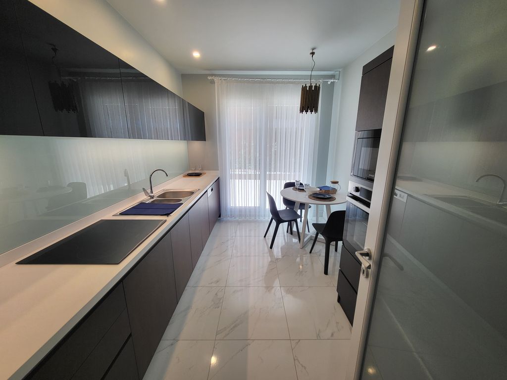 Property photo 3 of 22 Desirable Off-Plan Istanbul Properties For Sale - Fitted Kitchen And Seating Area