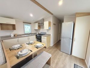 Property photo 3 of 5 Fully Equipped Kitchen With Dining Table And Bench Seating
