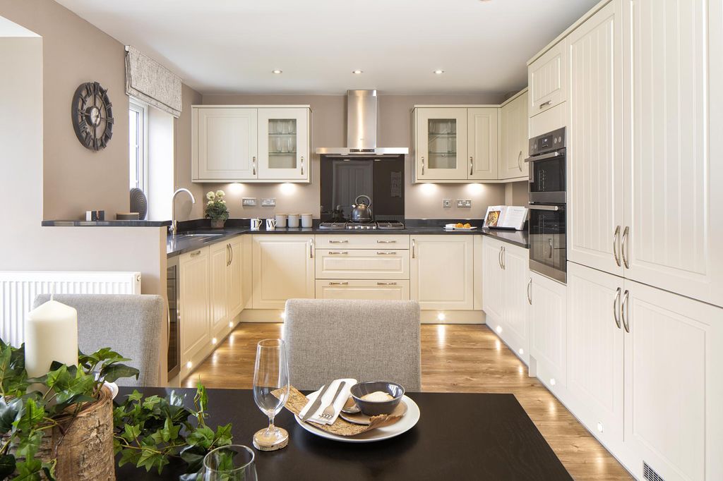 Property photo 2 of 10 Open-Plan Kitchen With Family And Dining Areas