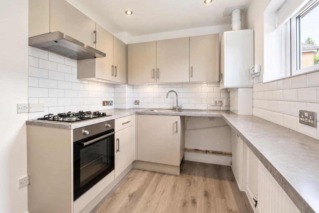 Property photo 3 of 11 Bright Modern Greige Kitchen.Png