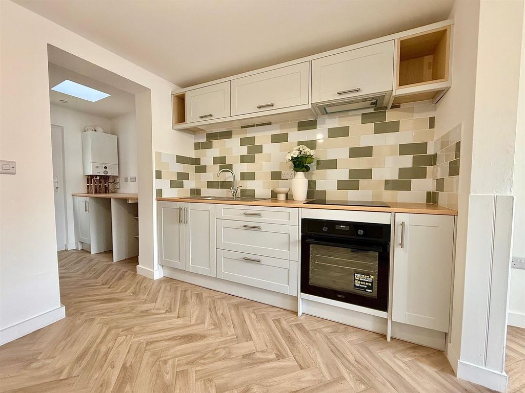 Property photo 2 of 16 Kitchen Area
