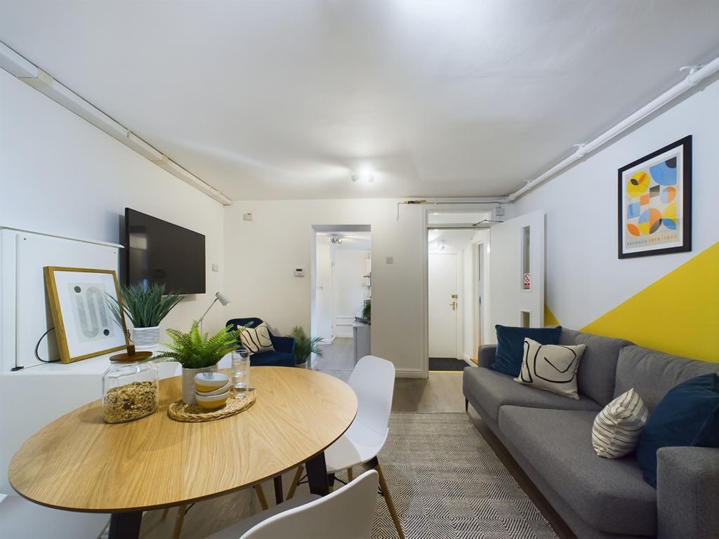 Property photo 2 of 11 A Contemporary And Inviting Living Room Featuring ...